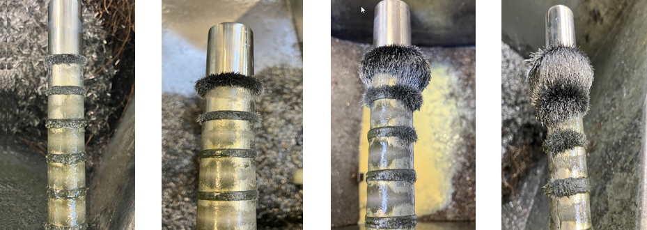 Mıknatıs çubuklar üzerindeki metal parçacıkları